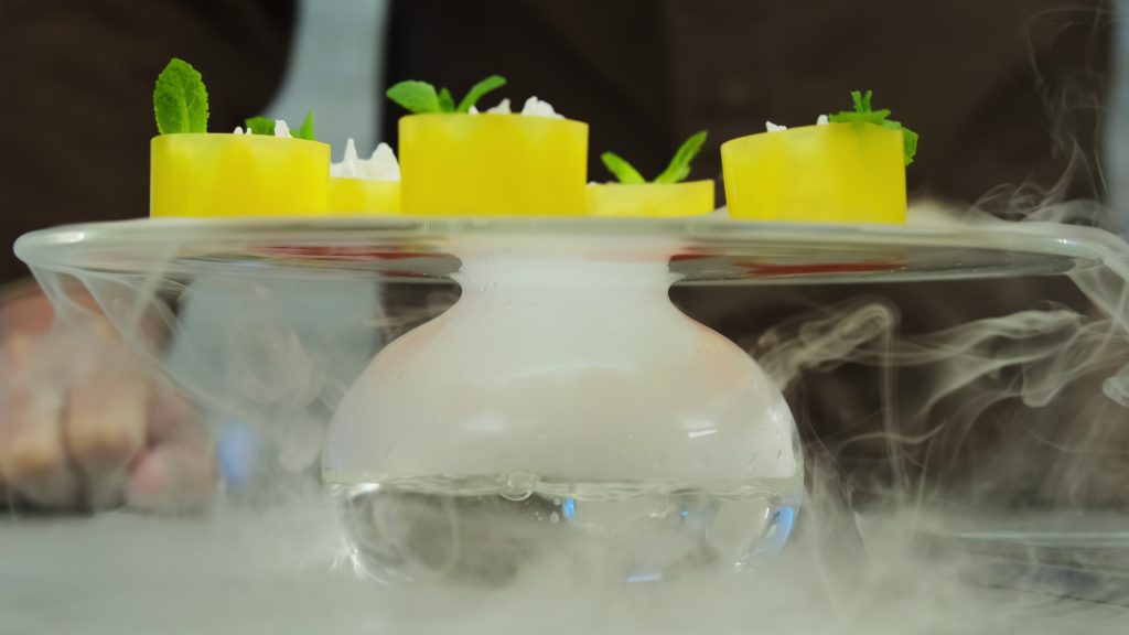 Glass stand for presentation of molecular cuisine dishes with nitrogen use. Intensive evaporation when dry ice interacts with water